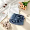 Conjunto de verano para chicas europeas y americanas: nuevo chaleco blanco + falda lápiz de mezclilla con volantes, elegante y chic, directamente de fábrica
