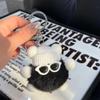 Suministro transfronterizo de piel de conejo Rex auténtica, pequeña bola de carbón, elfo, lindo muñeco de peluche, bola de carbón, colgante, llavero, bolso, colgante pequeño