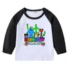 Camiseta infantil de primavera y otoño 2023, nueva camiseta de manga larga con cuello redondo y dibujos animados, camiseta de algodón para bebés y niños.