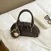 Bolsa de Ombro Fashion Retrô Feminina 2026 Nova Tendência Início do Outono Cor Sólida Pequena Quadrada Estilo Coreano Alto Valor Bolsa de Ombro Único