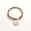 Nueva oferta especial pulsera de acero inoxidable con cuentas y colgante de cruz transfronteriza, alta calidad para mujer, cuenta redonda, acero de titanio, cordón elástico