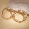 Brincos Redondos Espirais Geométricos de Metal Simples e Únicos Europeus e Americanos com um Toque de Luxo, Ecológicos e de Nicho