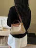 Tendencia transfronteriza 2026 nuevo modelo de bolso madre-hija, bolso de hombro y cruzado moderno y versátil, bolso cubo de mano de nicho con textura