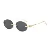 Gafas de sol retro ovaladas sin montura estilo europeo y americano para mujer, hacen que la cara se vea más pequeña, gafas de sol negras de moda casual estilo europeo y americano con protección UV