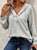 Sudadera con capucha de color liso abotonada, estilo nuevo, cómoda, elegante y versátil, moda femenina independiente transfronteriza europea y americana 2026