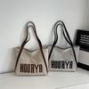 Bolsa Tote de Lona Bolsa Feminina de Grande Capacidade 2025 Nova Bolsa de Ombro Portátil de Nicho Bolsa para Estudantes Universitários para Aulas e Deslocamentos