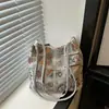 Bolso casual de diseño nicho para mujer, nuevo bolso de hombro de moda de verano, bolso de axila elegante, moderno y único 2026