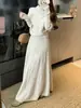 Conjunto de Tricô Retrô Francês para Mulheres 2026 Primavera Novo Estilo Suéter de Manga Longa Gola Alta Meia e Saia Elegante Conjunto de Duas Peças