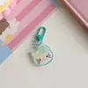 Nuevos accesorios de llavero de cabeza de gato KT de color caramelo transparente para primavera y verano, lindo colgante de corazón de chica Joker para mochila, venta al por mayor
