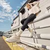 Tênis de Corrida Hongxing Erke Yunyi Feminino Novo Repelente à Água Amortecedor de Impacto Retorno Solado Grosso Leve Preto Sapatos Esportivos