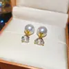 Pendientes geométricos de perlas y circonitas transfronterizos europeos y americanos, pendientes exquisitos de nicho de lujo ligero de alta gama, accesorios para orejas simples y elegantes para mujer