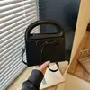 Bolsa de mão simples com laço transfronteiriça para mulheres, nova bolsa elegante e versátil de alta qualidade para ombro e transversal 2026