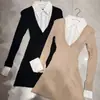 Vestido de punto negro puro y seductor estilo francés con diseño de dos piezas falsas, caracterizado por un cuello de camisa y una falda corta plisada para otoño