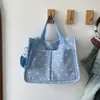 Bolso nuevo de moda versátil con estampado de lunares de terciopelo, tote casual, versión coreana de moda, bolso de hombro versátil de gran capacidad