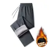 Calças masculinas de algodão transfronteiriças para uso ao ar livre, calças casuais juvenis com forro de fleece, calças à prova de vento e quentes, calças retas de inverno, calças esportivas para estudantes