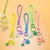 Venta al por mayor de pequeños, frescos, estilo coreano, flor de girasol acrílica, flor de goma suave, cordón trenzado hecho a mano, accesorios para cordón de teléfono