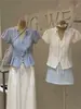 Wgwe9723 Ropa de Mujer Shisanxing de Guangzhou 2026 Verano Nuevo Top Camisa de Manga Corta con Cuello Polo y Cinturón