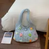 Bolsa Tote Estilo Doce Transfronteiriça para Mulheres Verão 2026 Nova Bolsa de Ombro com Flores Vazadas Bolsa de Braço Tendência