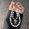Exquisito Cordón de Cristal para Teléfono con Alas de Ángel Cadena Versátil de Perlas para Teléfono Pulsera Llavero Colgante para Bolso Antiperdida
