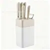 Conjunto de facas de aço inoxidável com sete peças, apresentando cabo horizontal e um bloco de facas quadrado, um conjunto de facas de cozinha de 7 peças