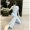 Conjunto Esportivo Casual Tie-Dye Jovem para Mulheres 2026 Verão Novo Estilo Coreano Manga Curta Calça Wide-Leg Conjunto de Duas Peças Tendência