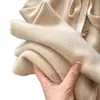 Estilo de otoño e invierno: Pantalones de lana virgen 100% australiana de tiro alto y pierna ancha para mujer, con una mezcla de lana suave y cómoda como una nube, y un diseño recto y largo.