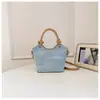 Yuezi Estilo Veraniego para Viajar Versátil Simple Moderno Bolso de Mano para Mujer 2026 Nuevo Bolso Cubo Moda Bolso de Mujer