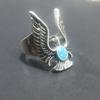 Anillo de águila voladora exagerado personalidad retro transfronterizo Europa y Estados Unidos moda callejera popular anillo de imitación turquesa azul con gota de pegamento