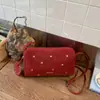 Bolso Pequeño Versátil con Tachuelas para Mujer de Principios de Primavera Transfronterizo 2026 Nueva Moda Bolso Almohada Texturizado Elegante Bolso de Hombro Cruzado