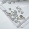 Diamante de Circonia Rosa con Base Plana para Arte de Uñas Modelo Transfronterizo de Cruz Caja de 12 Compartimentos Joyería Brillante de Circonia Rosa Claro de Tamaño Mediano para Uñas