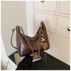 Bolso de Axila para Mujer 2026 Nuevo de Moda Verano Gama Alta Lujo Ligero Nicho para Viajes Diarios Bolso de Hombro Único Bolso Cruzado Retro