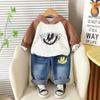 Conjunto Estiloso para Meninos 2025 Novo Duas Peças com Estampa de Rosto Sorridente Manga Longa Moda Bebê Primavera e Outono Moletom com Capuz Tendência Infantil