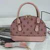 Bolso de concha de nicho estilo francés vintage para mujer, Nuevo de moda 2025 estilo Hong Kong material de retazos bolso de hombro y cruzado para mujer