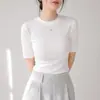 Camiseta de manga corta con cuello redondo de color liso para otoño, corte ajustado, elegante y estilizada, una prenda interior versátil para mujer, con un tacto de alta gama.