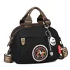 Bolsa de Moda Versátil para Mulheres 2025 Novo Modelo Bolsa Pequena Leve de Tecido Oxford Bolsa de Lona Feminina Bolsa Transversal Casual