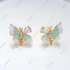 Anillo de Perla, Aretes, Colgante Juego de Tres Piezas con Diseño de Cristal de Goteo de Aceite de Mariposa Vacía, Lujo Ligero DIY de Gama Alta