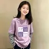 Camiseta de manga larga de algodón puro con retazos a rayas para niñas, versátil, para primavera y otoño, para niños mayores, estilo coreano, corte holgado, efecto dos piezas, moderna