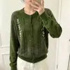 Cárdigan suéter verde floral tridimensional para mujer, nuevo modelo otoño 2026, chaqueta de punto exterior extremadamente elegante estilo coreano