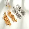Pendientes de pentagrama de moda con incrustaciones de circonita, estilo largo, pendientes de botón con borla de estrella súper de cuento de hadas, lujo ligero, moda de alta gama, pendientes elegantes y con estilo