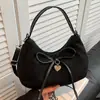 Bolso Retro de Ante tipo Dumpling Estilo Coreano Ins2026 Modelo Nuevo para Compras y Viajes, Bolso de Hombro Versátil con Lazo