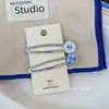 Pinza de flequillo azul estilo coreano con botón, pinzas BB estilo ins, diseño retro de nicho, pinza de pico de pato versátil, accesorio para el cabello