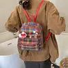 2026 Nueva Mochila de Cuadros Retro Versátil Campus Estudiante Femenina Bolsa Escolar Salida Viaje Lindo Casual Mochila