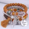 Pulsera de brazalete con colgante de borla de ala redonda estilo bohemio transfronterizo europeo y americano, pulsera de cuentas con cordón elástico multicapa