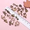 Mezcla de 20 colgantes pequeños de color bronce retro, bonitos colgantes de gato con forma de garra de gato, accesorios de joyería DIY.