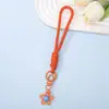 Correa tejida de flor para teléfono, colgante transparente de resina, correa para la muñeca, llavero para bolso, regalo pequeño, lote mixto