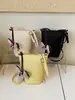 Bolso tipo cubo de moda simple y versátil para el verano 2026, con alto valor estético y textura premium, para llevar al hombro o cruzado