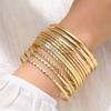 Pulsera ancha exagerada de personalidad retro transfronteriza de Europa y Estados Unidos, traje, pulsera irregular lisa dorada, juego de pulseras de varias piezas