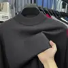 Suéter de cuello alto cruzado al por mayor para hombre, nuevo estilo otoño e invierno 2026, camiseta básica de punto versátil de color liso para hombres de mediana edad
