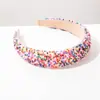 Diadema Heming, un nuevo modelo transfronterizo de estilo europeo y americano, presenta coloridos abalorios de arroz y un diseño ancho de esponja, lo que la convierte en un accesorio para el cabello hermoso, dulce y versátil.