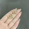 Pendientes Minimalistas de Corazón Hueco con Tachuelas de Diamante Super Brillantes Estilo Coreano Pendientes Dulces Elegantes Exquisitos de Nicho Pendientes de Moda Populares